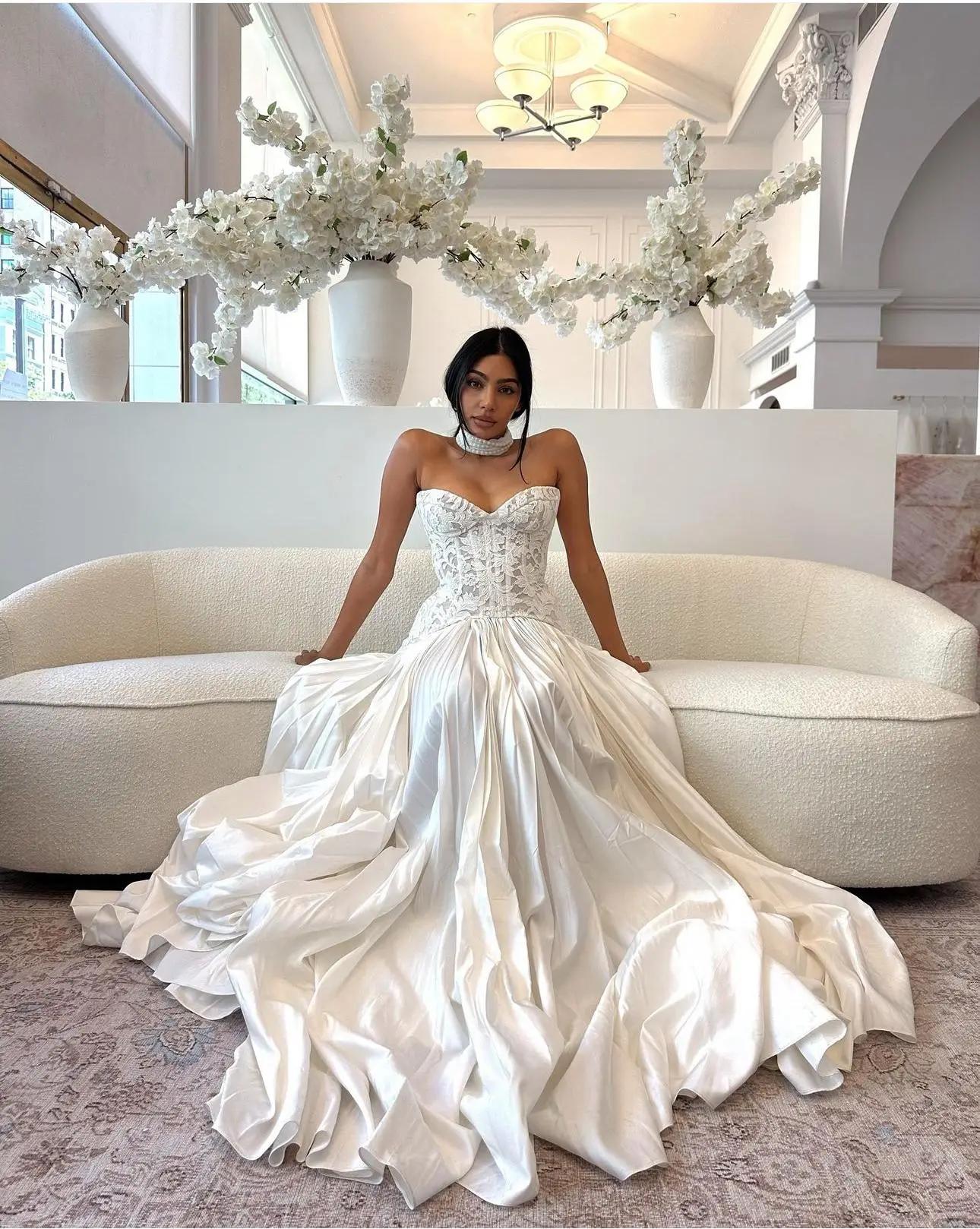 Model wearing a white gown