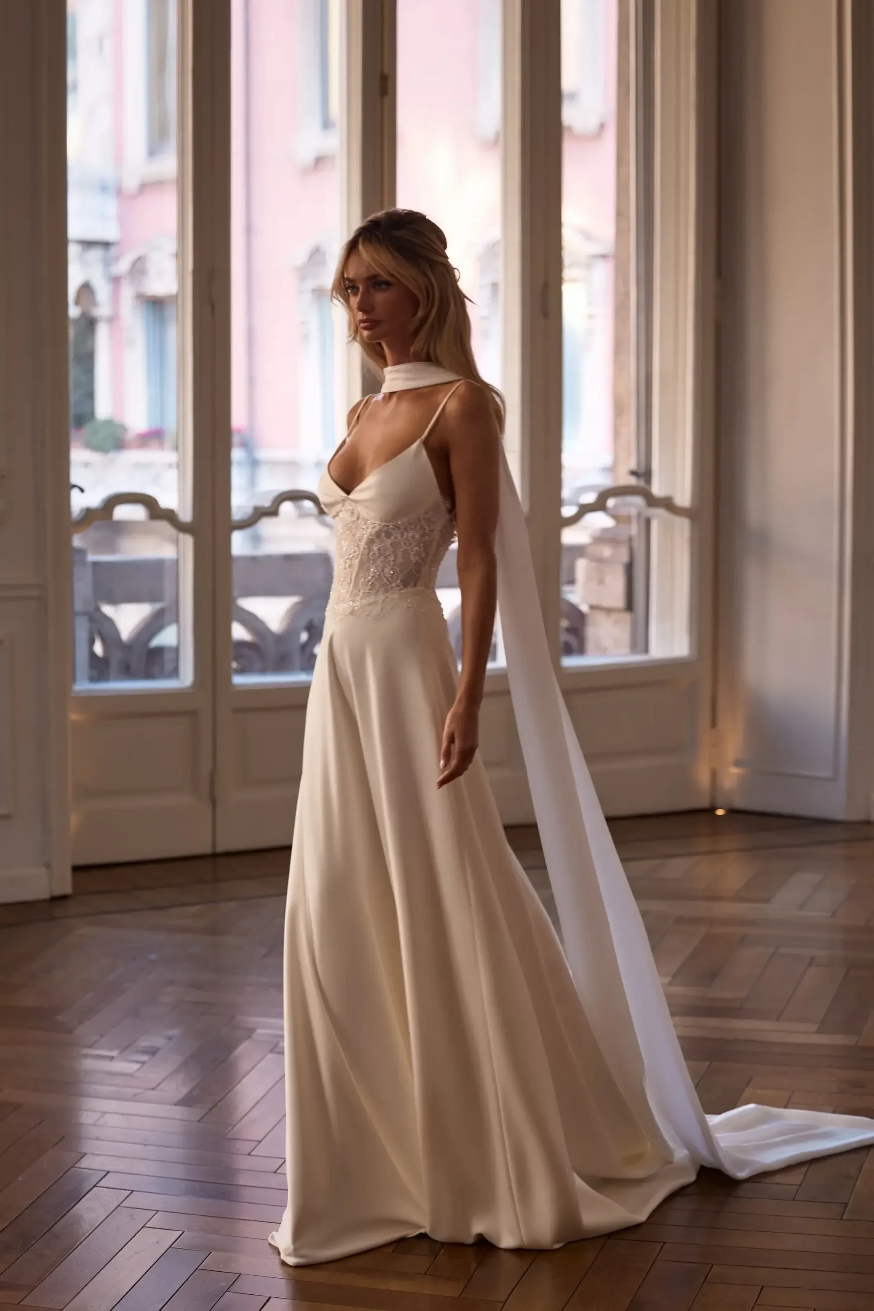 model is wearing a sleeveless a-line bridal gown by milla nova